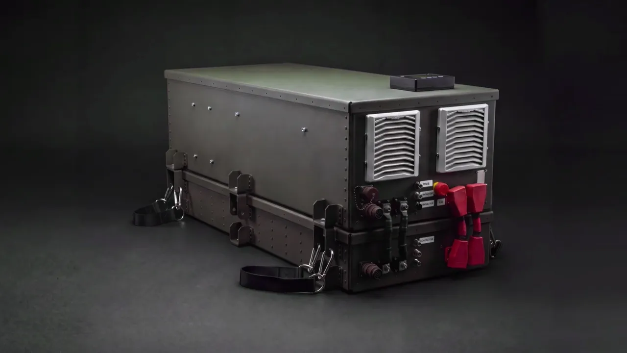 The SPM Power Export Kit (PEK) on a dark studio backdrop, its end panel with cooling vents and power connectors facing the camera